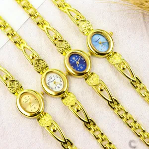 Women vintage minimalist bracelet quartz watch detail view, oval dial with heart strap.
