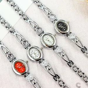 Women quartz watch oval dial crystal heart bracelet elegant fashion timepiece wristwatch chic accessory.