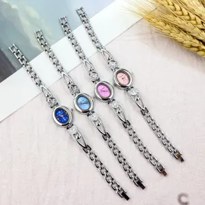 Detailed view of women bracelet quartz watch featuring elegant oval dial and heart shaped strap.