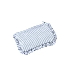 Blue white striped cosmetic bag with ruffled edges, portable pouch for travel daily makeup storage.