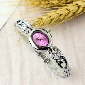 Elegant women quartz watch with purple oval dial and cute heart bracelet strap. Perfect gift.