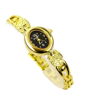 Vintage women gold quartz watch with oval dial and heart bracelet links for daily wear.