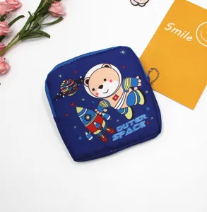 Detail view of the cute blue cartoon astronaut bear pouch, featuring a smooth zipper.