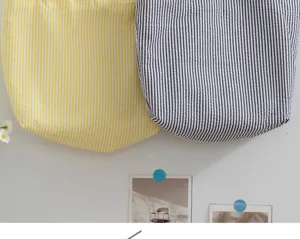 Detail view of striped tote bag fabric, casual summer style, soft textured striped design.