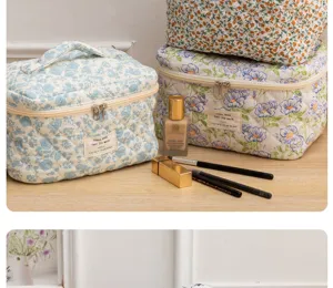 Quilted floral cosmetic bag, cute portable makeup storage pouch with zipper and handle for travel daily use.