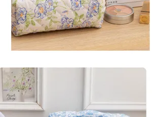 Close-up detail of a fresh floral cotton cosmetic pouch with blue and green flower patterns.