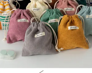 Colorful corduroy drawstring storage bag, portable makeup pouch and coin purse for daily use.