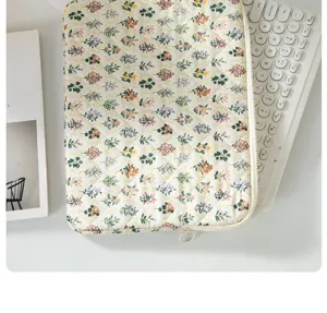 Floral quilted laptop sleeve 13 inch cute tablet protective case with smooth zipper closure.