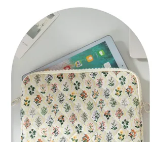 Quilted floral tablet sleeve detail shot showing cute Korean style and soft padded fabric protection.