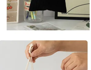 Detail shot of corduroy drawstring storage bag with white pull cords for portable daily use