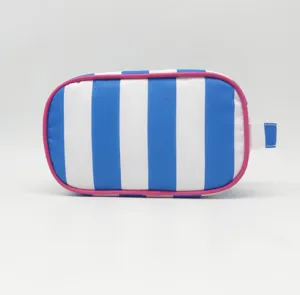 Blue white striped cosmetic bag with pink trim and side handle for daily travel use.