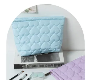 Light blue quilted heart cosmetic bag, soft puffer makeup pouch, large capacity storage case.