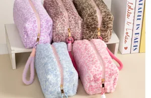 Fluffy leopard print cosmetic bag large capacity plush makeup pouch portable travel organizer.