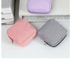 Portable striped seersucker cosmetic bag travel coin purse mini sanitary napkin storage pouch.