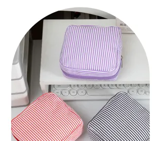 Seersucker striped cosmetic bag portable zipper storage pouch for makeup coins and small items.