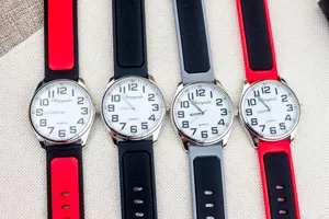 Men quartz watch detail showing silicone straps, clear Arabic numerals and color options.