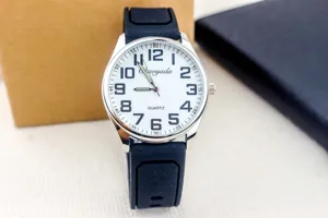 Men's quartz watch with white dial and black silicone strap, clear numbers detail view.