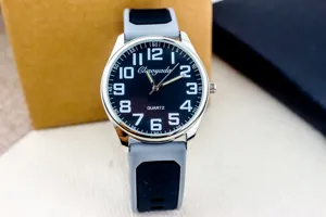 Detailed close-up of a stylish men's quartz watch with bold numbers and silicone strap.