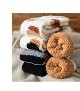 Detail shot of women's thick plush coral fleece socks, ultra soft warm cozy sleep floor socks.