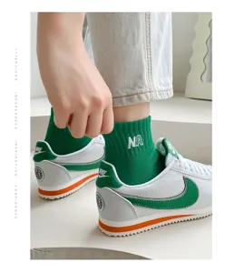 Green mid-tube cotton socks for women, stylish Japanese sports socks with NA embroidery.