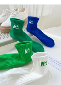 Casual cotton mid-tube socks featuring letter embroidery, perfect for daily wear and sports.