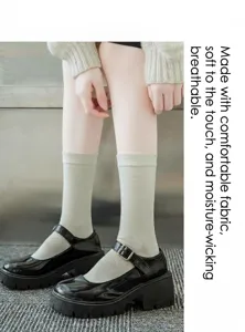 Women pure cotton mid-tube socks paired with black platform shoes, comfortable casual footwear.