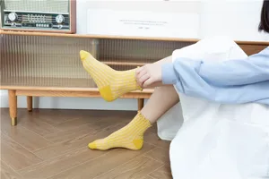 Japanese retro plaid ruffled mid-tube cotton socks for women, cute college style detail.