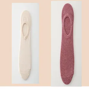 Detail view of women's low-cut boat socks in solid colors, showing thin cotton fabric texture.
