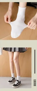 Detailed view of white cotton mid-tube socks with great elasticity and comfortable fit.