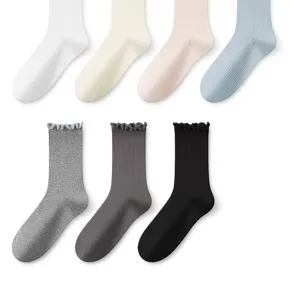 Detailed view of women ribbed mid tube socks with sweet lace ruffle cuffs in multi colors.