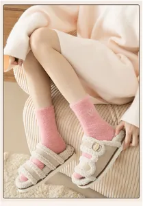 Cozy thick mink fleece mid-tube women socks with cute heart embroidery for autumn winter warmth.
