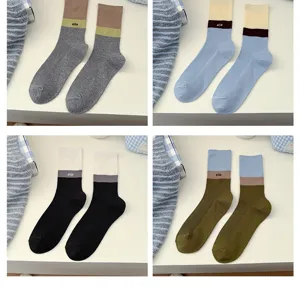 Detailed view of women colorblock mid tube combed cotton socks with sweet design details.
