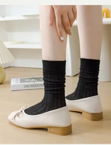 Black knit sheer crew socks for women, breathable summer hosiery, cute JK style footwear.