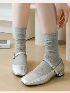 Japanese style women's thin cotton solid color ribbed crew socks paired with cute silver shoes.