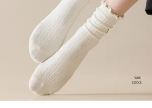 White ribbed tube socks for women, cute ruffle cuff and soft cotton knit fabric, sweet style.