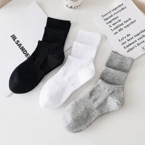 Comfortable solid color casual crew socks for men and women, soft basic socks in multi colors.