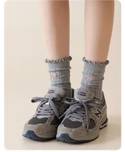 Grey cotton mid-tube socks featuring sweet pink bow embroidery in cute ballet style