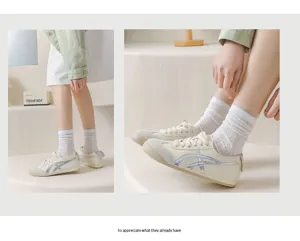Close-up detail view of breathable hollow wave pattern women socks, elegant sheer mesh style.