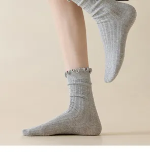 Grey ribbed ruffle socks for women, cute cozy stacking mid-tube cotton knit hosiery.