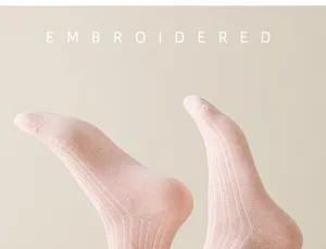 Women casual pink ribbed mid-tube socks detail, comfortable soft knit daily wear style.