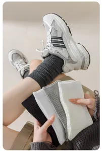 Detailed view of women's ribbed cotton mid-calf socks in classic colors, soft and cozy.
