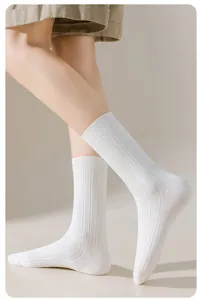 Close-up detail view of white ribbed mid-tube socks, soft pure cotton, daily comfort wear.