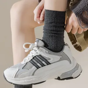 Women's dark gray ribbed crew socks, comfortable cotton knit slouch socks for autumn and winter daily wear.