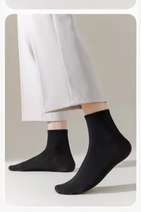 High quality mens black cotton crew socks featuring ribbed cuffs, breathable and comfortable.