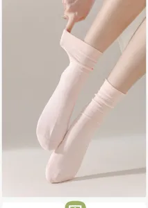 Detailed view of women's soft pink cotton slouch socks, comfortable breathable mid-tube design.