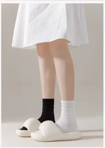 Women summer thin mid-calf cotton socks paired with chunky casual sandals detail view