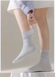 Comfortable breathable cotton mid-tube socks for women, soft solid color daily wear.