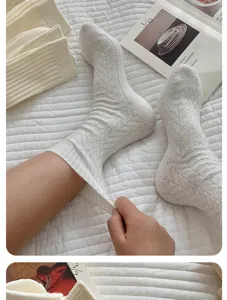 Cozy white knitted wool slouch socks for women, thick warm winter hosiery and daily wear.