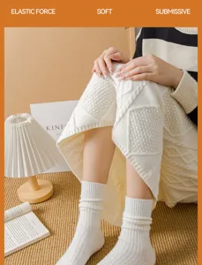 Cozy thick woolen socks for women, warm winter cashmere crew socks with soft ribbed texture.