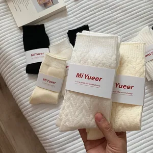 Thickened fleece-lined wool slouch socks for women, warm winter mid-tube socks in white and beige.